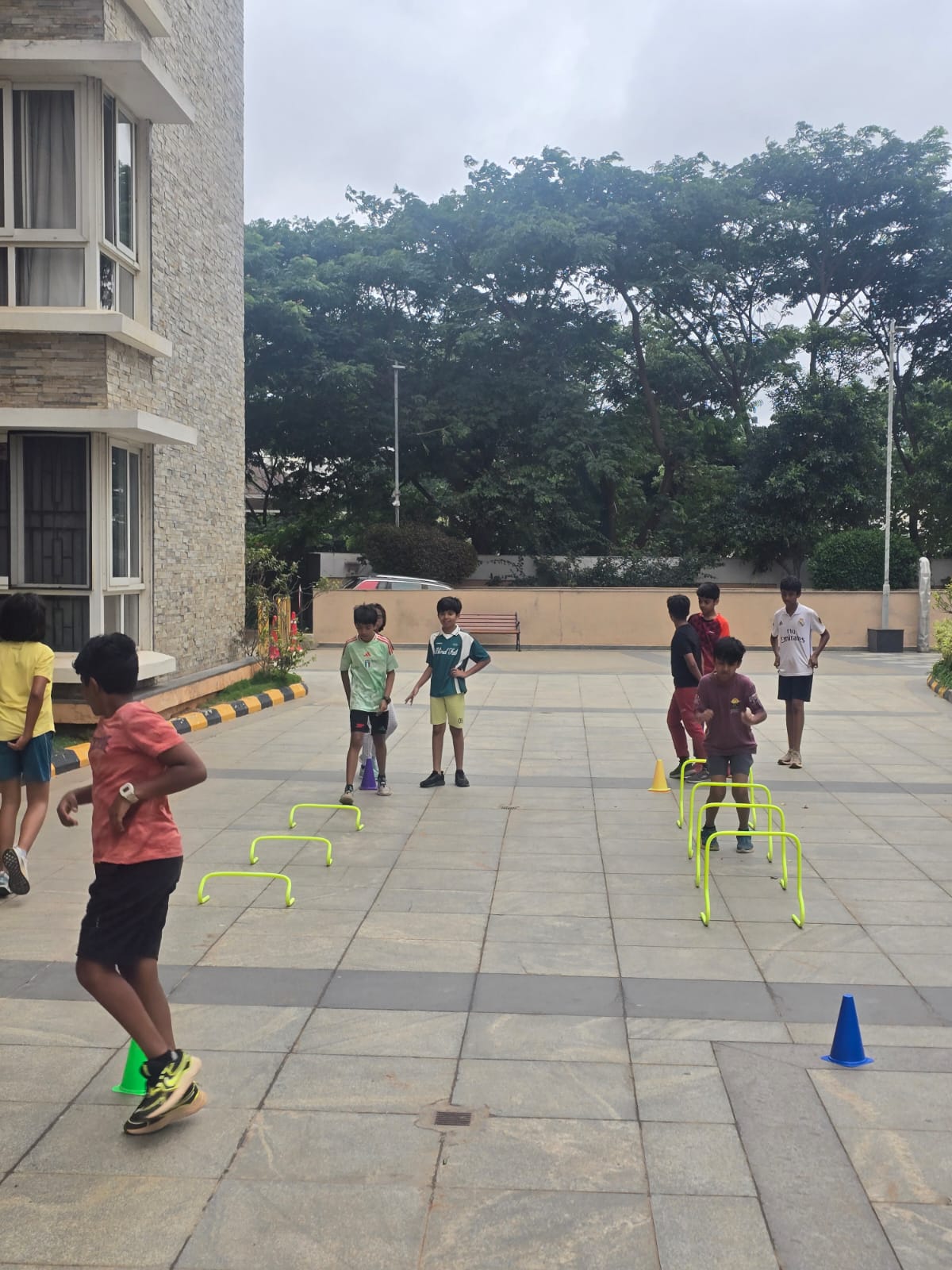 kids jumping hurdles